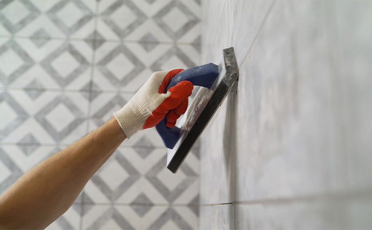 wall tile being grouted